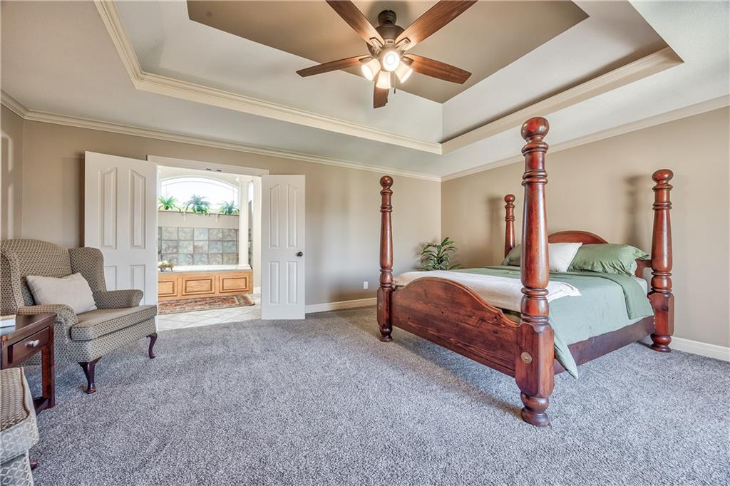 Primary bedroom with tray ceiling